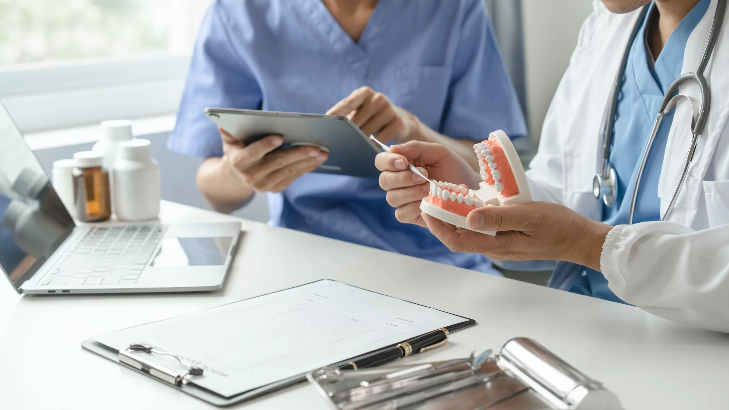 Team of doctors and dentists talking and working